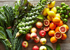 a group of fruits and vegetables on a wood surface Healthy Weight Loss Diets Northampton