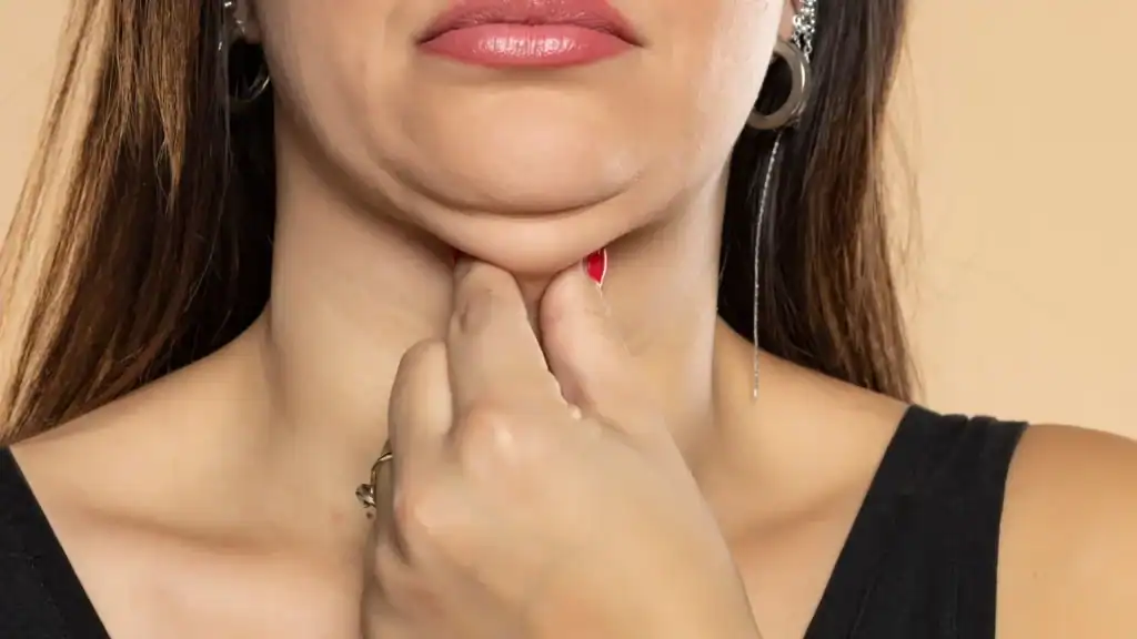 An image of a woman with double chin, sad, worried : Non Surgical Double Chin Removal Treatment in Northampton, UK